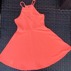 Neon Coral ribbed summer dress with asymmetrical placement on bust